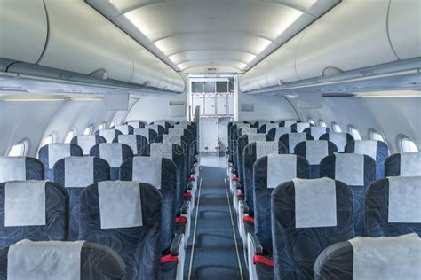 Airplane Cabin And Aisle With Empty Seats In Economy Class Stock Image
