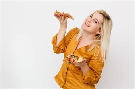 Premium Photo Beautiful Blond Woman Eatting Piece Of Pizza