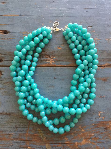 Bright Turquoise Beaded Necklace Featuring Strands Of Lightweight