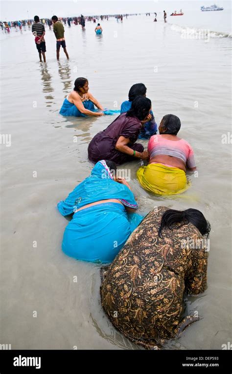 Women Bath In The Holy Water Of Gangasagar Island During The Annual