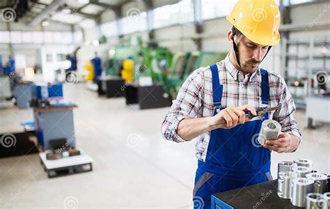 Male Worker And Quality Control Inspection In Factory Stock Photo
