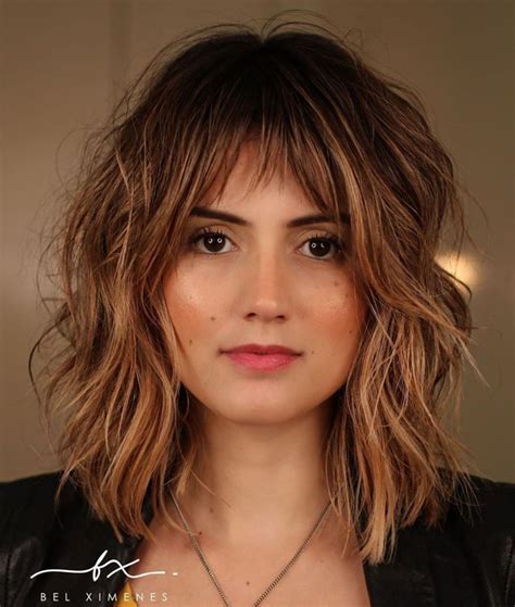 Women with round faces will appreciate the way a medium haircut with bangs and angled layers elongates and slims down the face. 70 Best Variations of a Medium Shag Haircut for Your ...