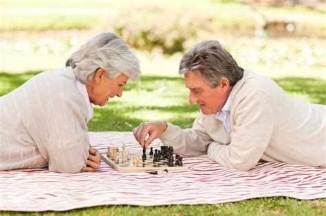 Premium Photo Elderly Couple Playing Chess