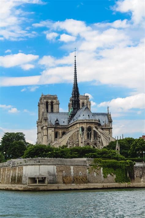 Notre Dame Cathedral On A Background Of Blue Sky With Clouds Stock