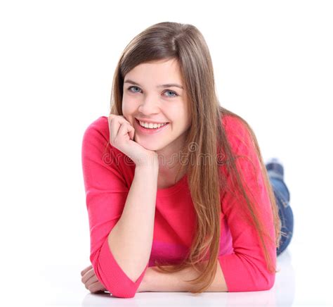 Portrait Of A Smiling Young Woman Lying On The Floor Stock Image