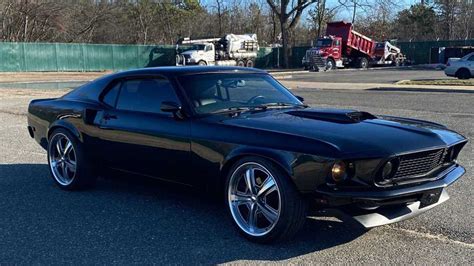 Drive Off In This 1969 Ford Mustang Sportsroof Coupe Restomod Motorious