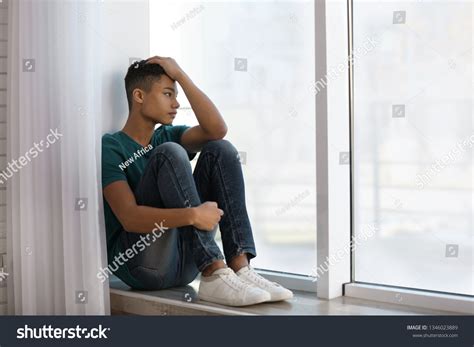 Upset Africanamerican Teenage Boy Sitting Alone Stock Photo 1346023889