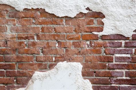 Brick Wall With Cracked Plaster Stock Photo By Madrabothair