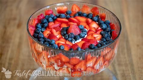strawberry blueberry and raspberry trifle tastefully balanced