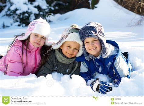Three Children Playing In Snow Stock Photo Image 1837318