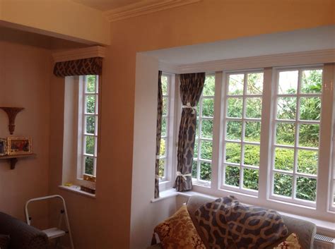 Roman blind fitted under a wooden pelmet. | Roman blinds, Blinds