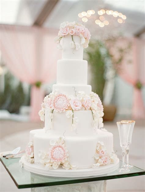 Gone are the days of nothing but fruitcake; Pastel Flower-Topped White Wedding Cake