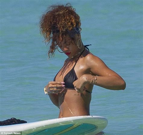 Rihanna Bares Her Body In A G String Bikini While Sunbathing On A Surfboard Daily Mail Online