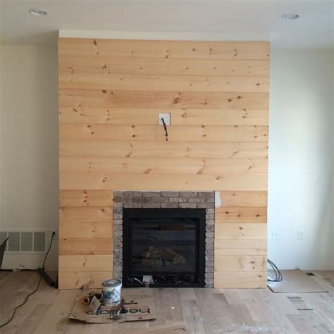 We had a big fireplace in the center of our living room with a ton of potential, but it needed a lot of work. DIY Shiplap Fireplace Wall | Diy shiplap fireplace ...