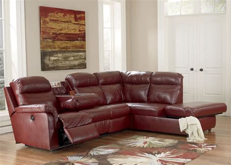 Brown Leather Sectional Sleeper Sofa With Recliner And Small Table On