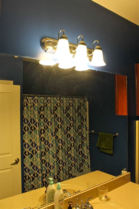 Each bathroom fixture tells its own story about the homeowner's style, vision and uniqueness. Upgrading a Standard Bathroom Light Fixture with a Dip of ...