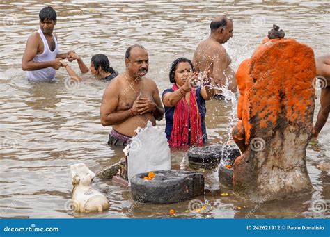 Kumbh Mela Devotees Offer Prayers After Taking A Bath In The Sacred