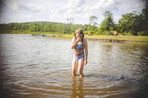 Girl Swimming In A Lake Stock Photo OFFSET