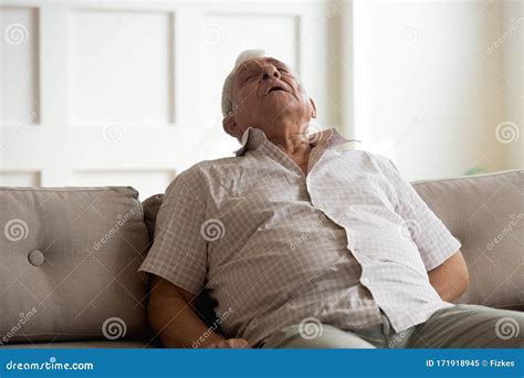 Exhausted Elderly Man Fall Asleep On Couch At Home Stock Image Image