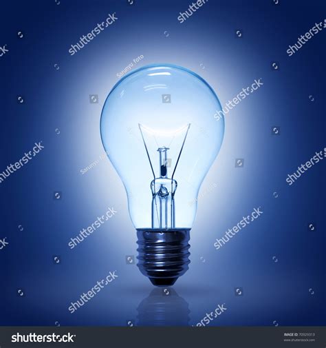 Light Bulb On Blue Background Stock Photo 70929313 Shutterstock