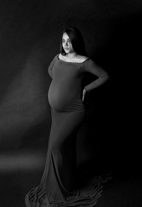 A Black And White Maternity Photo Shoot Featuring A Pregnant Woman By