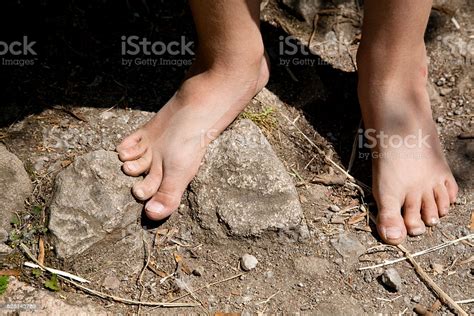 Boy with his feet together in the air. Bare Feet Off A Boy Stock Photo & More Pictures of Barefoot | iStock