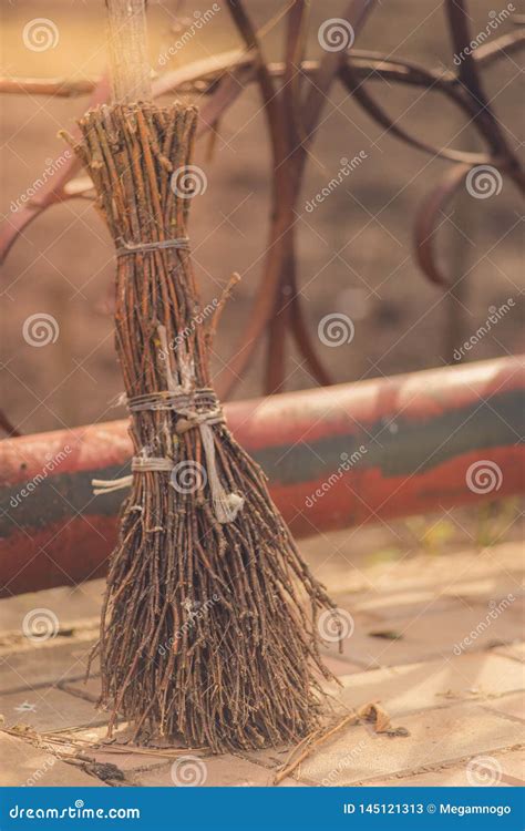 Old Homemade Broom Made From The Branches Stands In The Courtyard Stock