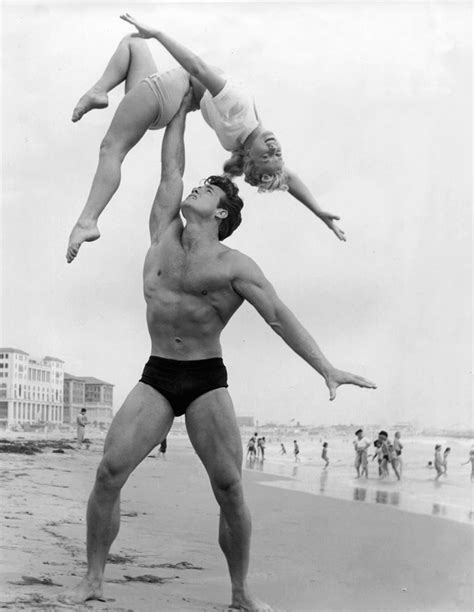 Bodybuilding Pioneer Steve Reeves With An Unknown Woman On
