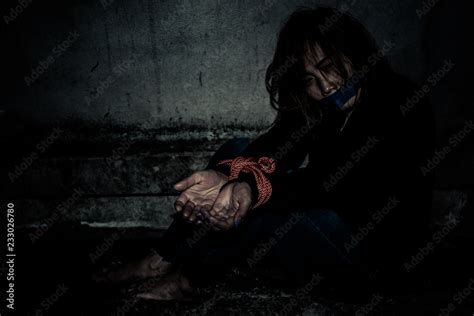 Asian Hostage Woman Bound With Rope At Night Scenethe Thieves