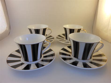 Fiesta coffee cups and saucers. Set of 4 petite coffee cups and saucers. They are black ...