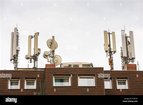 Telecommunication Antennas On The Roof Of The Building Stock Photo Alamy
