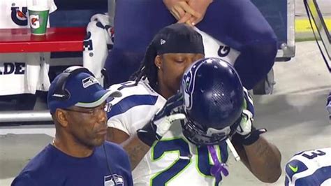 Marshawn Lynch Looks For Skittles On The Sideline