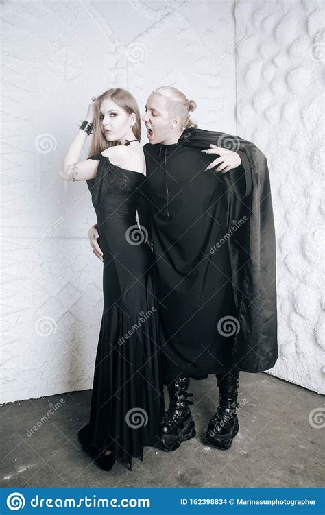 Young Vampire Love Couple In Black Halloween Costumes Ready For The