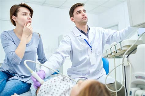 Doctors Seriously Looking At Medical Device Stock Image Image Of
