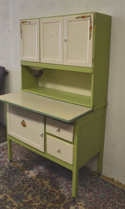 A hoosier style country cabinet with a flour sifter has a wood frame on casters with metal components. Antique 1920's Hoosier Cabinet with Flour Sifter Porcelain ...