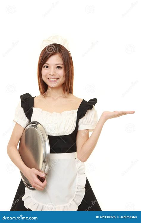 Young Japanese Woman Wearing French Maid Costume With Tray Stock Photo