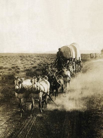 Covered Wagons On The Plains Going West Photographic Print Bettmann