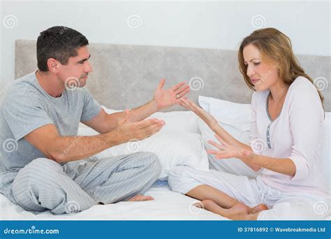 Frustrated Couple In Bedroom Stock Photo Image Of Arguing Mature