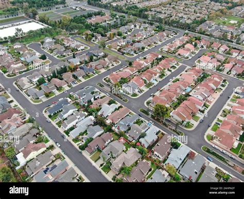 Aerial View Of Urban Sprawl Suburban Packed Homes Neighborhood With