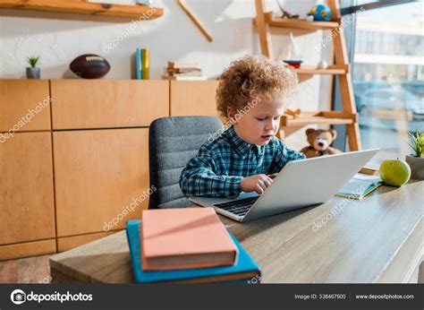 Selective Focus Curly Kid Typing Laptop Books Stock Photo By