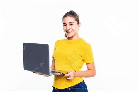 Free Photo Smiling Cute Teen Girl Using Laptop Over White Wall