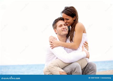 Couple Enjoying Each Other S Company On The Beach Royalty Free Stock