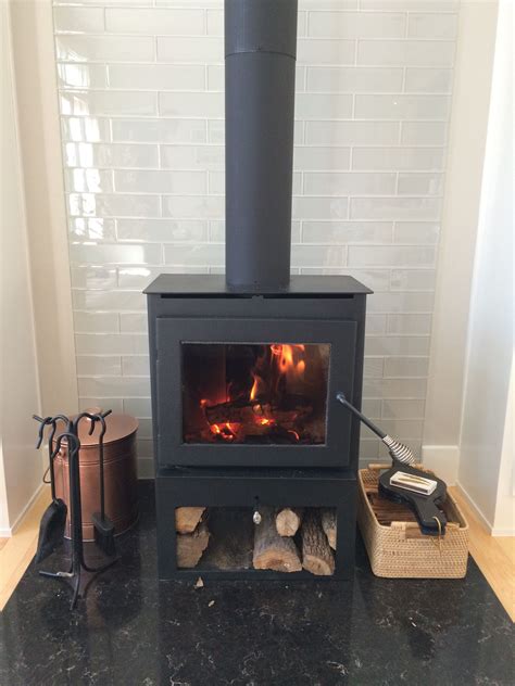 We are building a raised hearth for under a wood burning stove. Wood-burning stove with glass 3x12 tile behind | Poele a ...