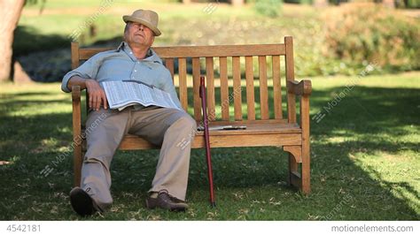 Old Man Sleeping On A Bench Stock Video Footage 4542181