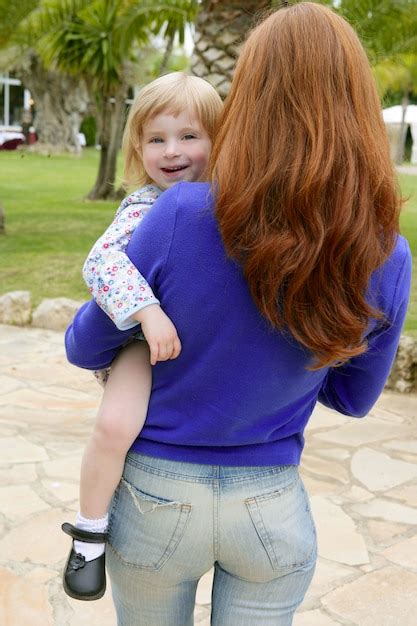 Premium Photo Redhead Mother And Blond Daughter Playing