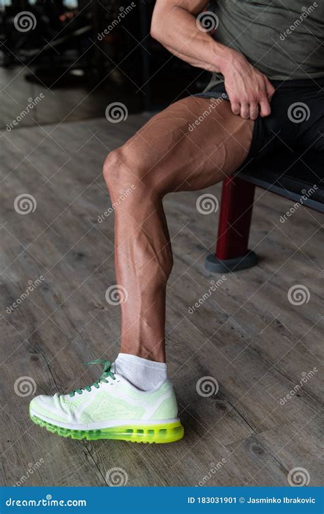 Man In Gym Showing His Well Trained Legs Close Up Stock Image Image