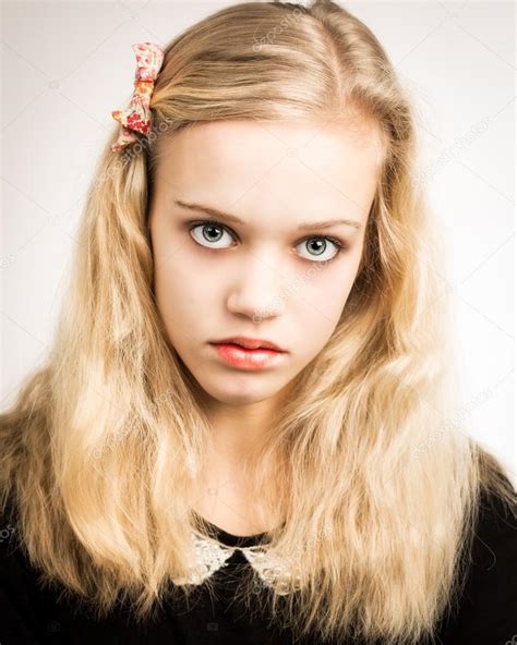Beautiful Blond Teenage Girl Looking In The Camera Stock Photo By