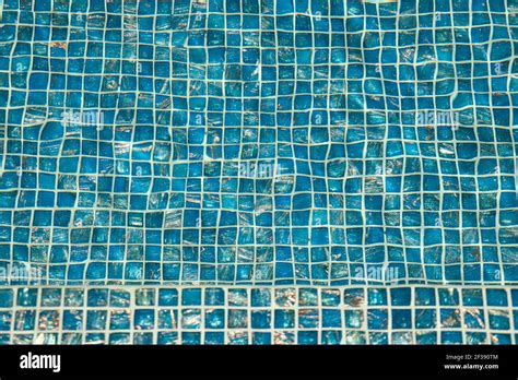 A Pool With Blue Ceramic Tiles And Water Ripple Effect Refection Of Blue Water In Swimming Pool