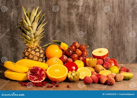 Fresh Fruit In A Composition On A Dark Background Warm Light Front