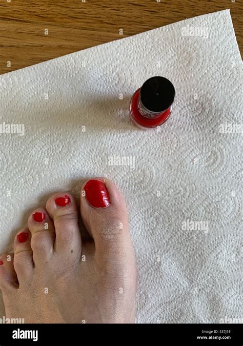 Toe Nails Being Painted Red Stock Photo Alamy